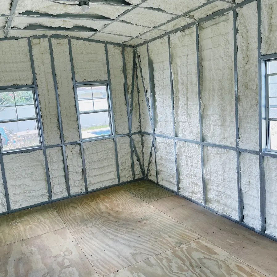 Closed-cell spray foam insulation applied to wall cavities in a residential project in Lake Villa